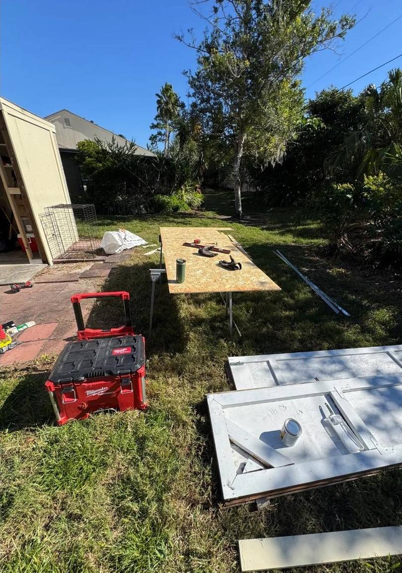 New storage doors laid out and prepped outdoors before installation