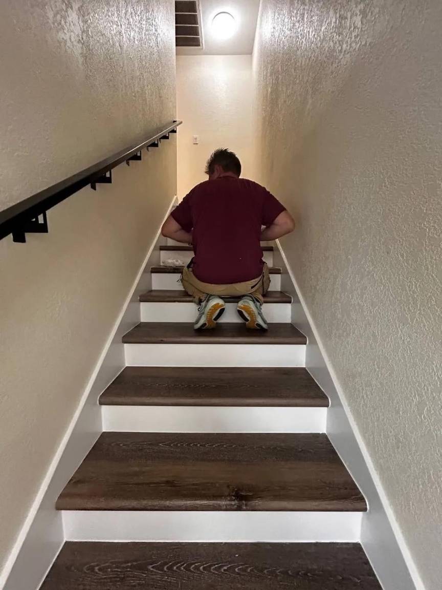 Roman fitting luxury vinyl treads on the upper steps of the staircase